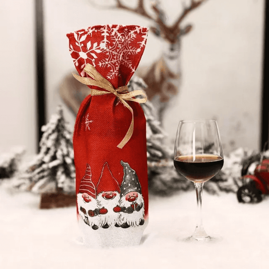Christmas Wine Bottle Bag - Wine Gift Bag | Reusable, Elegant red cloth bag with Santa gnome print and gold ribbon, ideal for festive wine gifting.