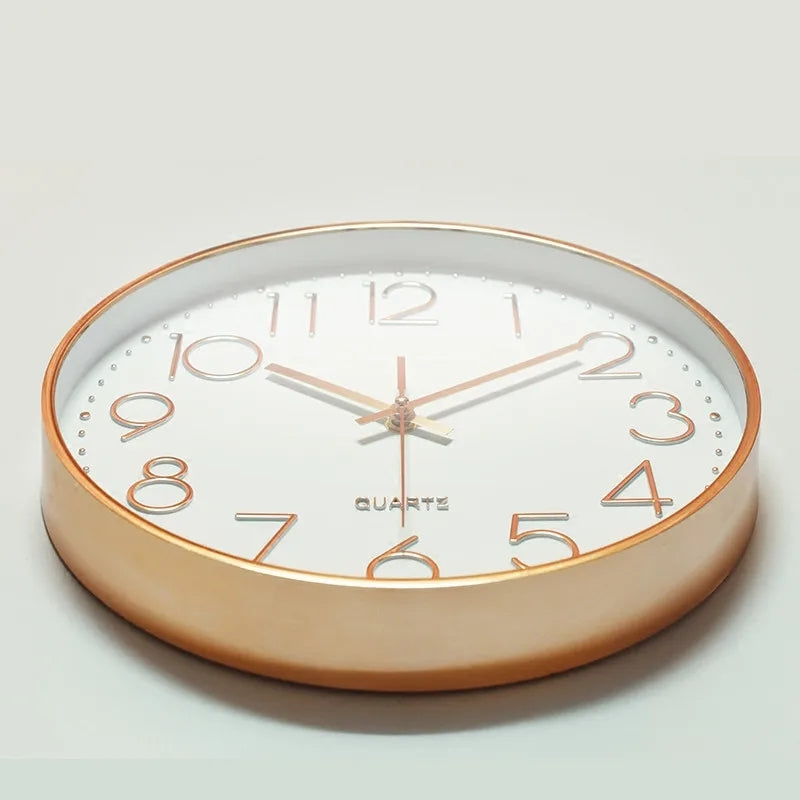 Side view of Modern White Rose Wall Clock 11" showing its rose gold metal frame and clear glass face, perfect for home interiors.