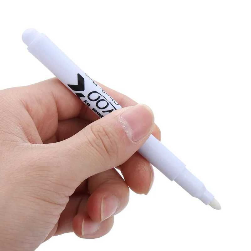 White Liquid Chalk Marker held in hand, ideal for writing on glass or chalkboards with easy-clean ink for office or kitchen use.