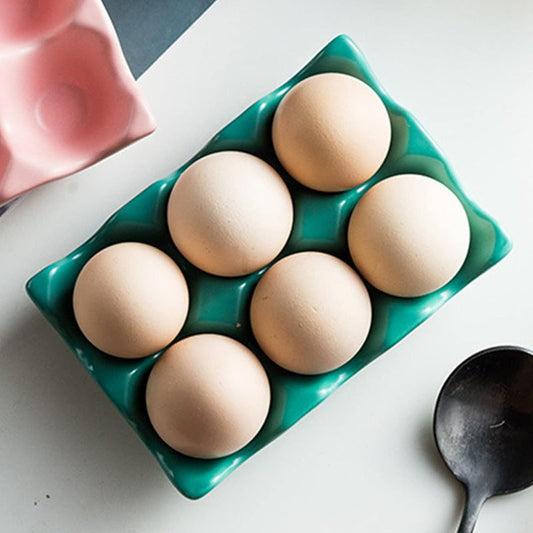 Ceramic Egg Holder 6 Grid in green holding six brown eggs, ideal for organized kitchen storage and meal prep convenience.