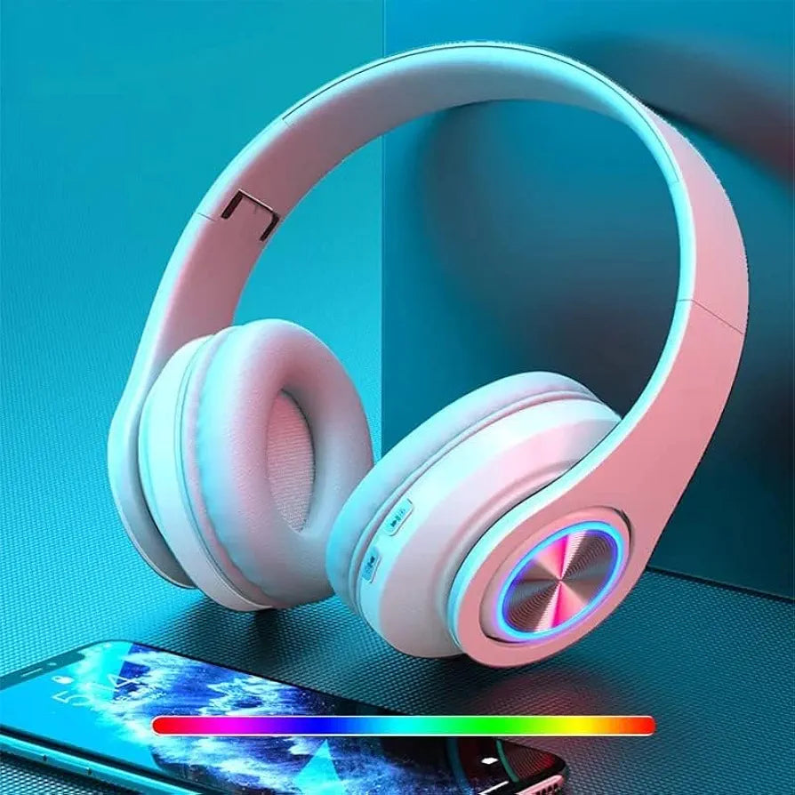 White B39 Bluetooth Wireless Gaming Headset Foldable with LED lighting, placed near a smartphone, ideal for immersive mobile gaming.