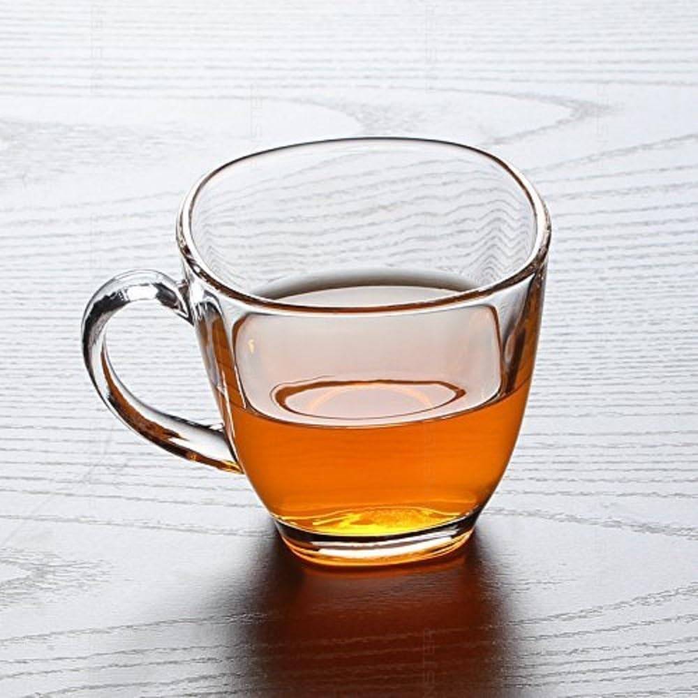 Heat-resistant glass tea cup filled with tea from the 6 Cups Glass Tea Set. Elegant square design ideal for daily tea enjoyment and flavor clarity.