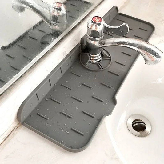 Gray Kitchen Sink Portable Mat installed around faucet base, effectively preventing water spills on bathroom or kitchen countertops.