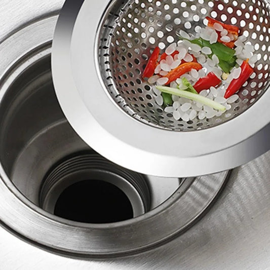 High-quality Stainless Steel Kitchen Sink Strainer Stopper catching vegetable scraps in a modern sink, perfect for clog prevention and hygiene.
