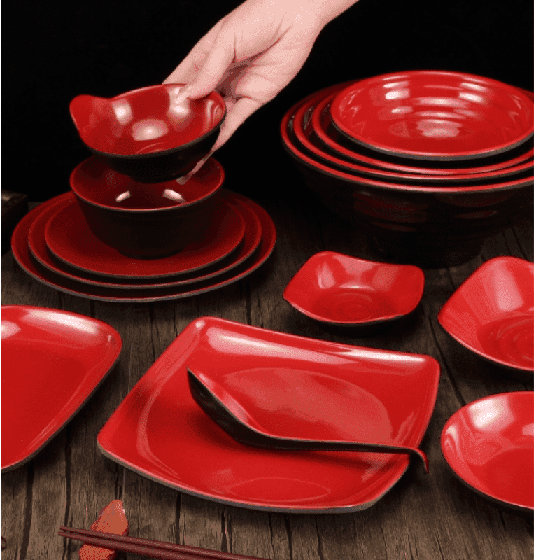 Red melamine tableware set featuring square plates, bowls, and spoons. Stylish and durable dinnerware for kitchen and dining in Sri Lanka.