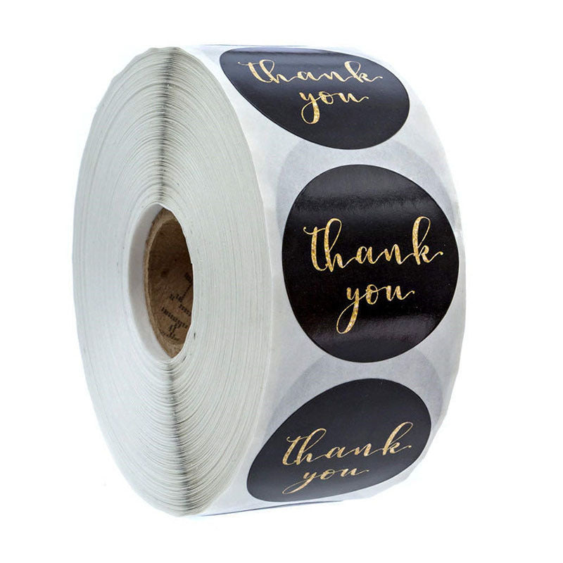 Thank You Stickers Label for Small Business, 500 PCS roll with 1.5-inch black round labels featuring gold script, ideal for packaging and gifting.