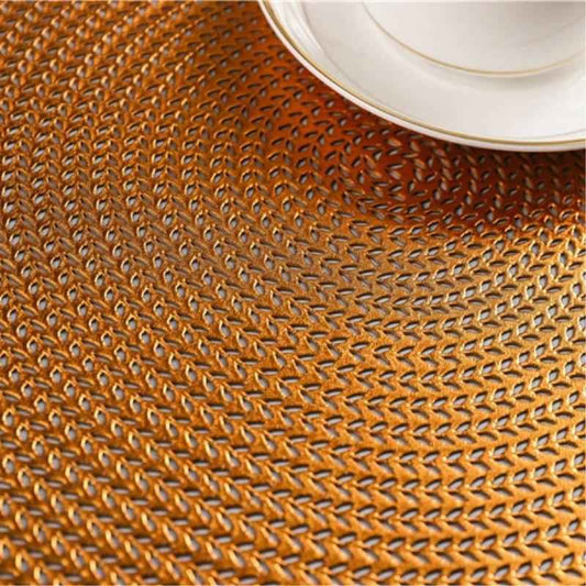 Close-up of Gold Round PVC Table Placemat 38cm showing textured, durable surface perfect for protecting kitchen and dining surfaces.