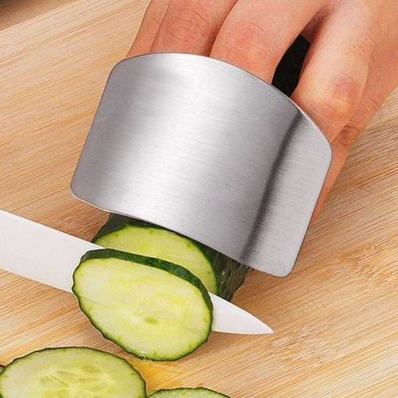 Stainless Steel Finger Guard - Safe Cutting Tool shields fingers during precise cucumber slicing, ideal for kitchen safety and efficiency.