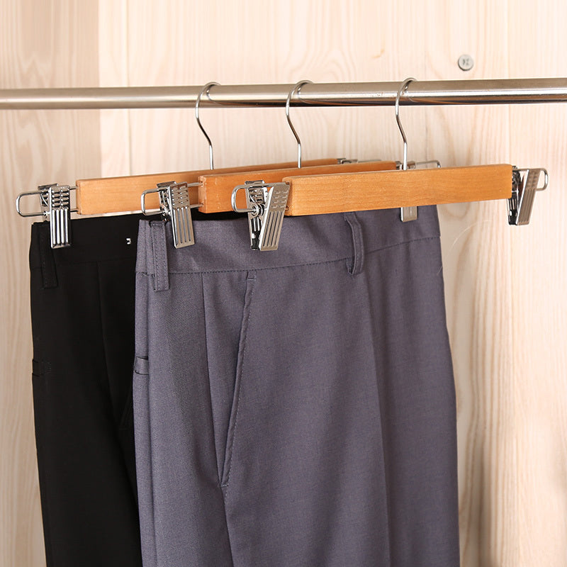 3PCS Wooden Jeans Hanger with Clips securely holding pants in a wardrobe, ideal for neat and stylish closet organization in Sri Lanka.