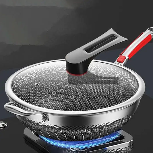 Stainless Steel Nonstick Wok 32 cm Stir Frypan on gas stove with lid, featuring honeycomb texture and ergonomic red handle for even heating.
