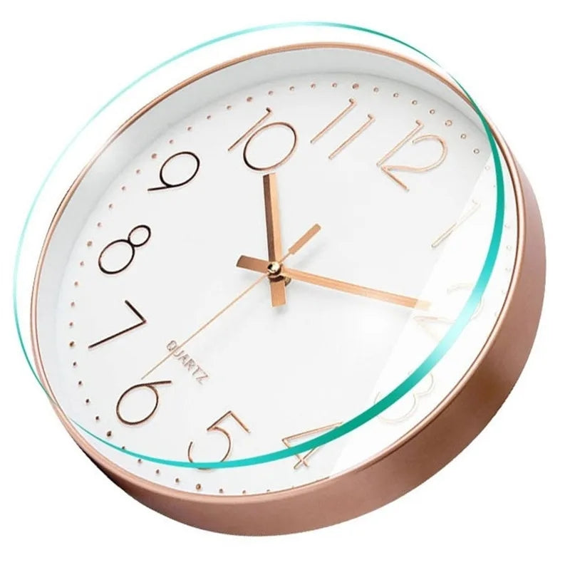 Angled close-up of Modern White Rose Wall Clock 11" highlighting its sleek rose gold finish and vintage-style hands and numbers.
