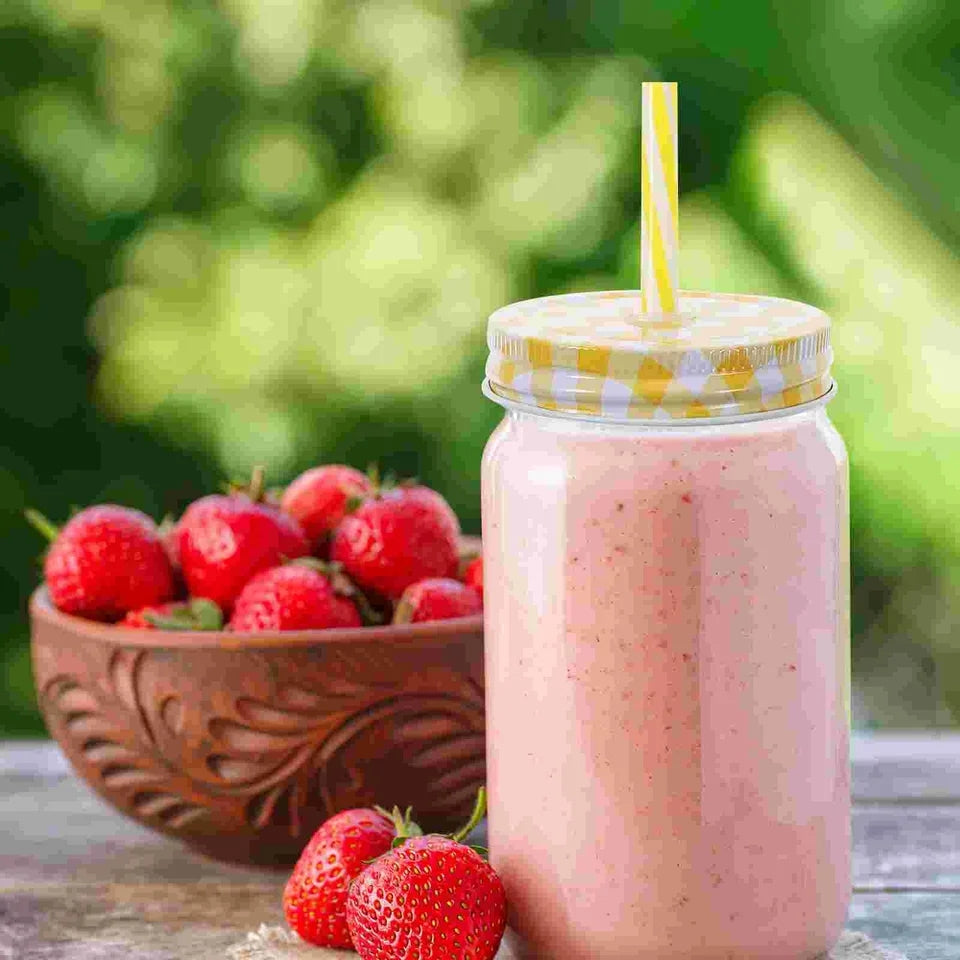 Glass Mason Jar - Classic 490ml glass jar with yellow gingham lid and straw, filled with a fresh strawberry smoothie. Great for beverages and storage.