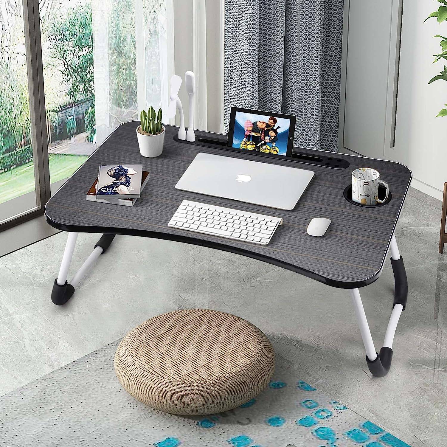 Portable Laptop Desk - Adjustable Folding Table in dark wood finish with ergonomic design, ideal for bed or floor use with laptop and accessories.