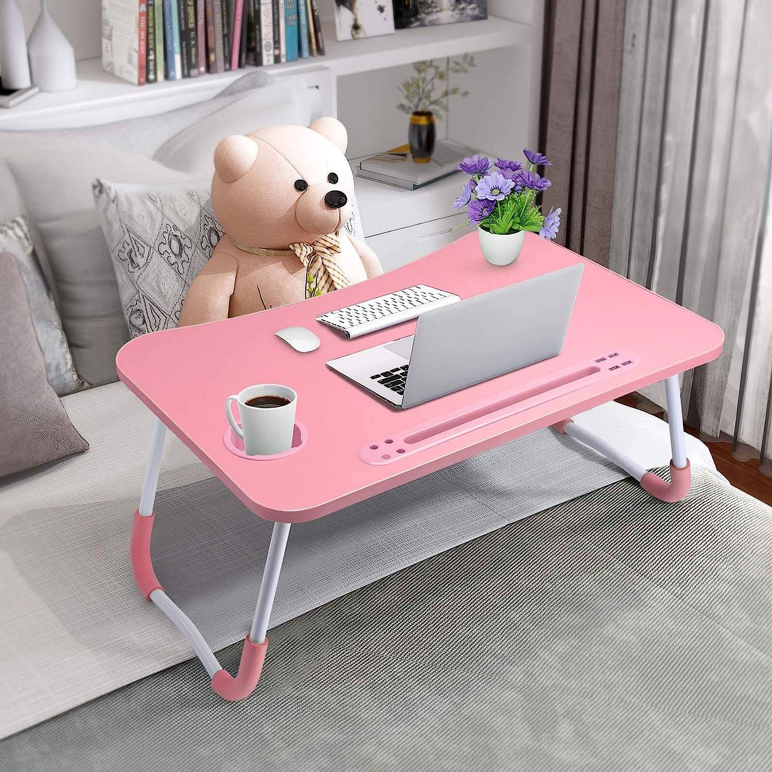 Portable Laptop Desk - Adjustable Folding Table in pink color, lightweight and foldable, perfect for home office or study setup on bed or sofa.