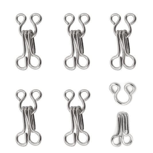 20 pairs silver sewing hooks and eye closures for garments. Durable fasteners ideal for tailoring, crafts, and custom clothing projects.