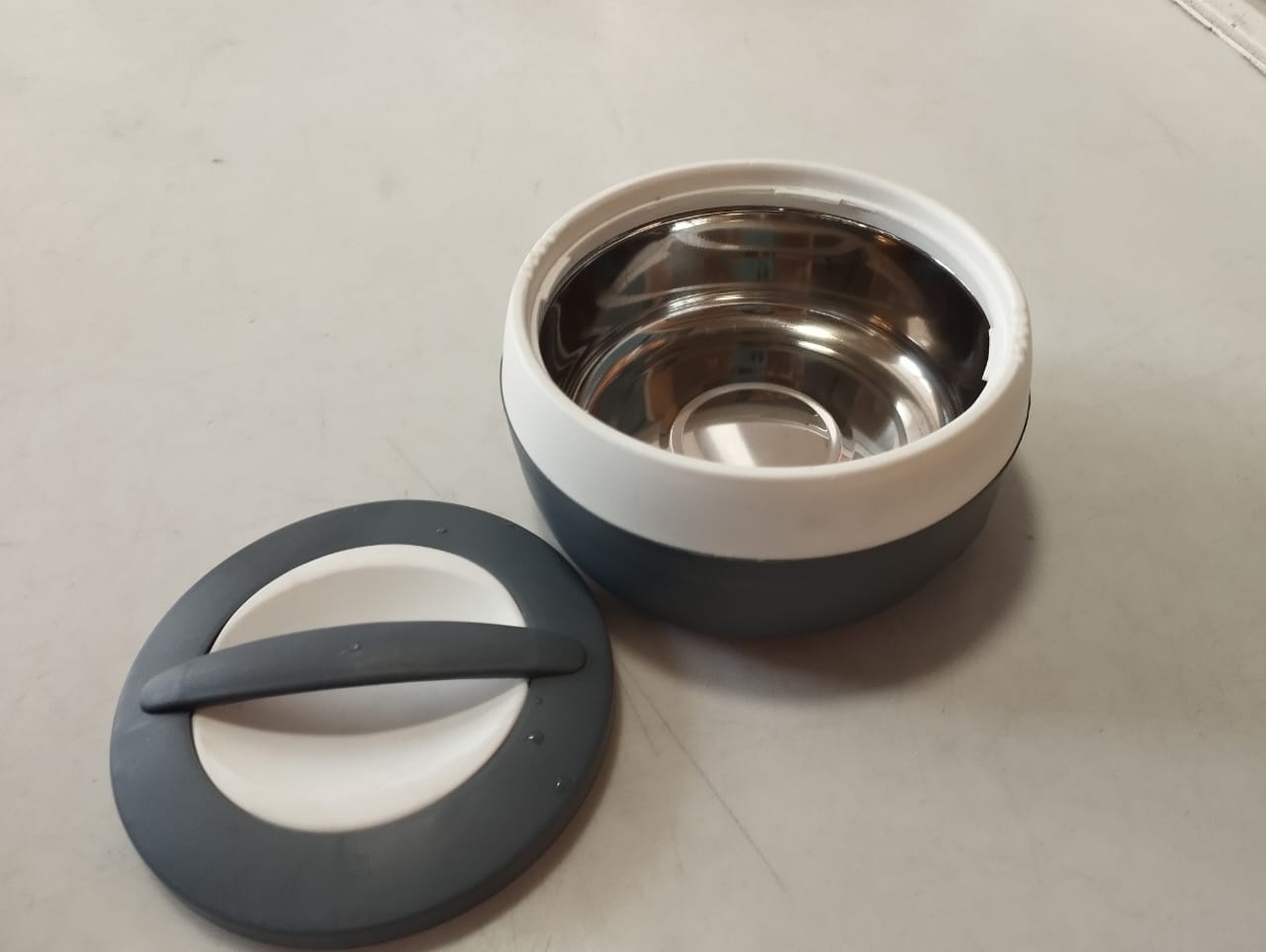 Double Layer Food Warmer Container 600 ml with stainless steel interior and grey lid, ideal for keeping meals warm in kitchen and dining use.