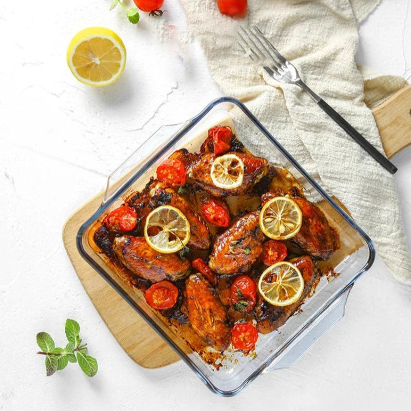 Borosilicate Glass Square Oven Tray with baked chicken, cherry tomatoes, and lemon slices. Ideal bakeware dish for roasting in Sri Lanka kitchens.