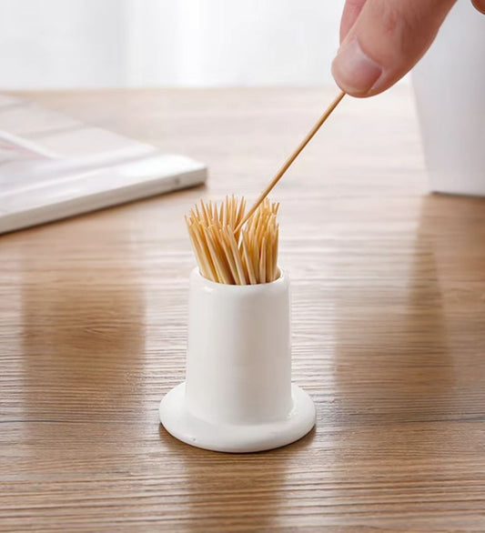 White Ceramic Toothpick Holder filled with wooden toothpicks, ideal for kitchen storage and dining table organization.