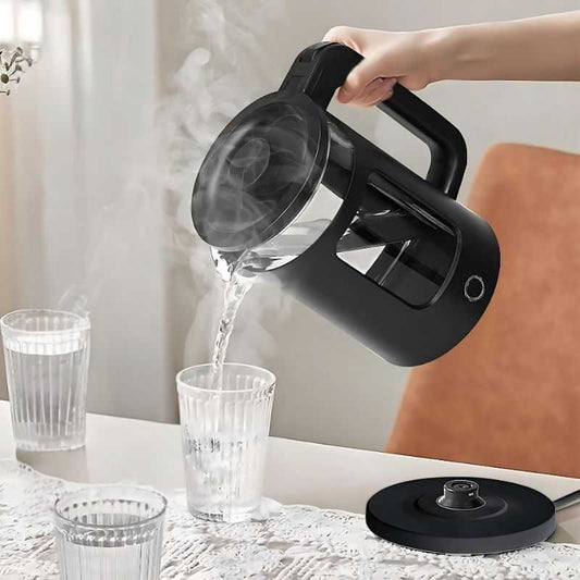 Glass Cordless Kettle 1.8L - Richpower pouring hot water into a glass, showcasing steam and ergonomic handle for easy use in kitchen and dining settings.