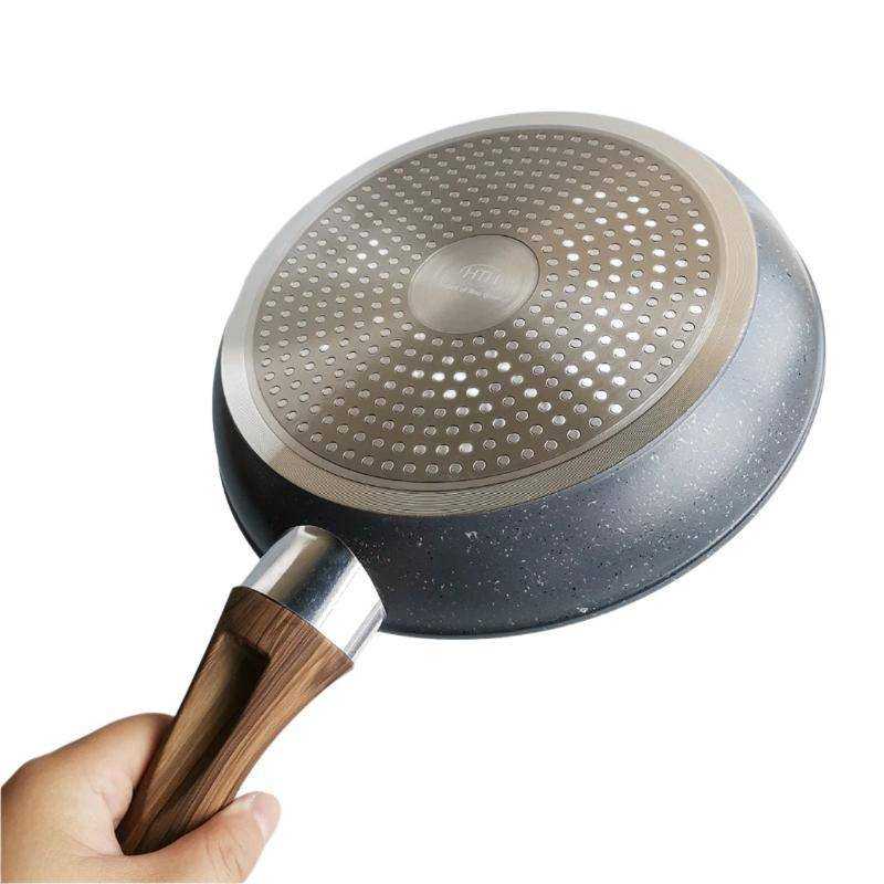 Bottom view of HotChef Non-Stick Marble Fry Pan 26 cm with induction base and ergonomic wood-style handle for efficient heat distribution.