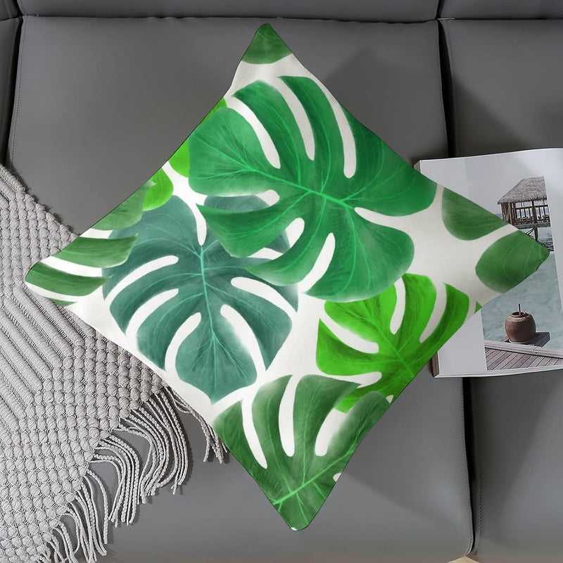 Green Leaf Cushion Cover 45x45 cm Polyester displayed on a grey sofa, showcasing its bold leaf design and modern home decor appeal.