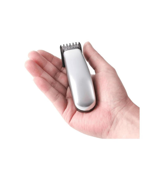 Compact NIKAI Electric Hair Trimmer for Men shown in hand for size reference. Ideal for precise beard and hair grooming at home.