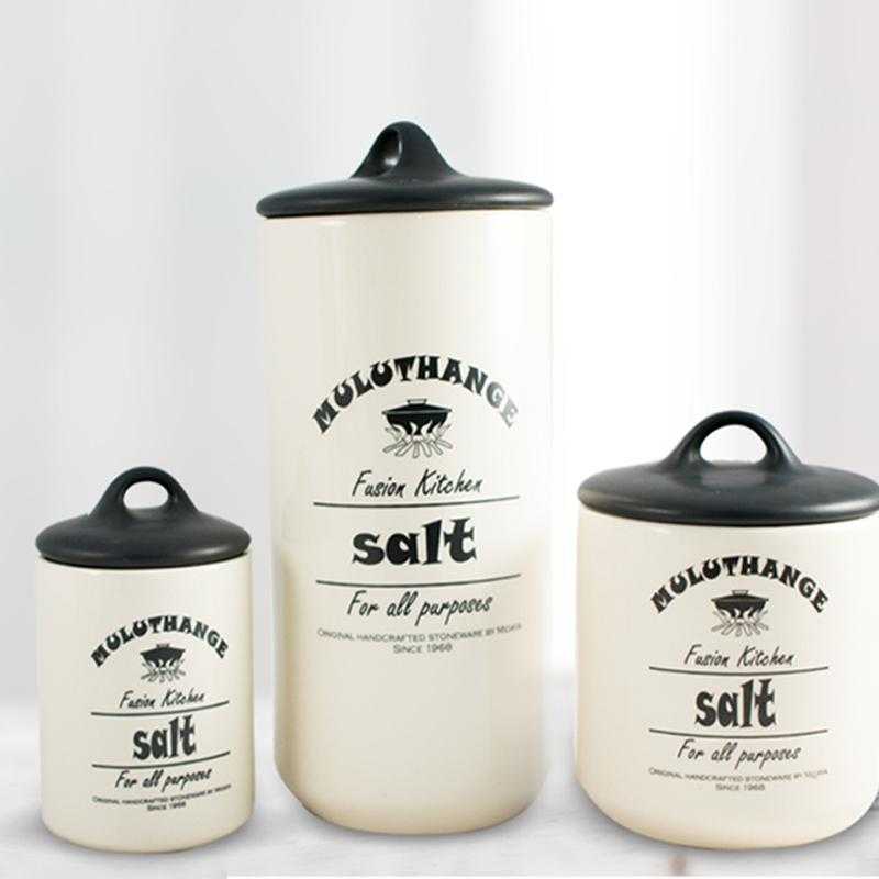 Set of Muluthange ceramic salt jars in various sizes with black lids, perfect for kitchen storage. Shop online at Bamagate.com.