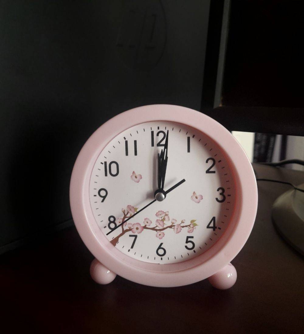 Pink Desktop Alarm Clock for Girls with cherry blossom design, ideal for stylish bedroom decor and accurate timekeeping on desks or nightstands.