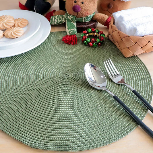 6PCS Green Round Braided Placemat 38 cm adds festive charm to table settings with its durable, washable PVC design, ideal for holiday dining decor.