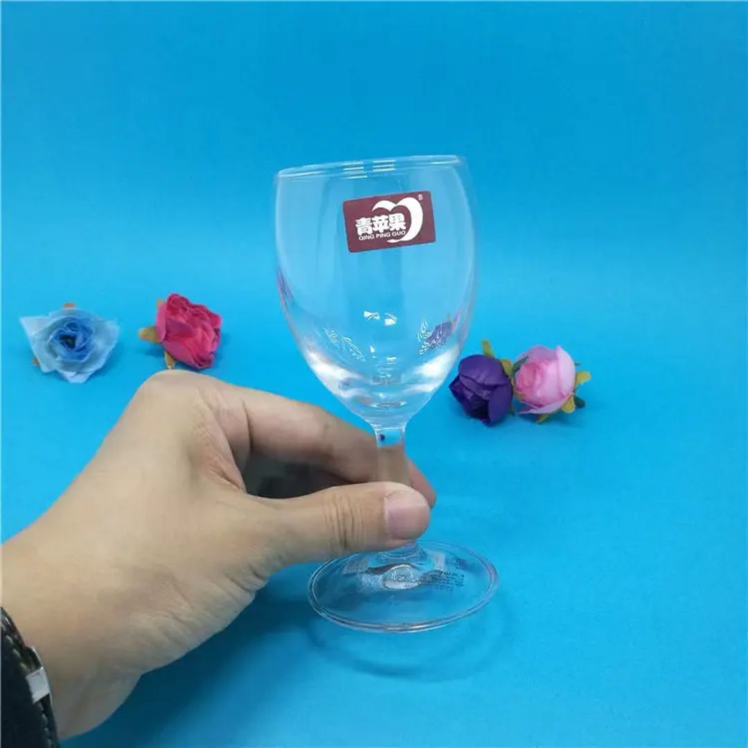 Hand holding a 235 ml short stem red wine glass from 6PCS set, perfect for home or party use. Available in Sri Lanka at great value.