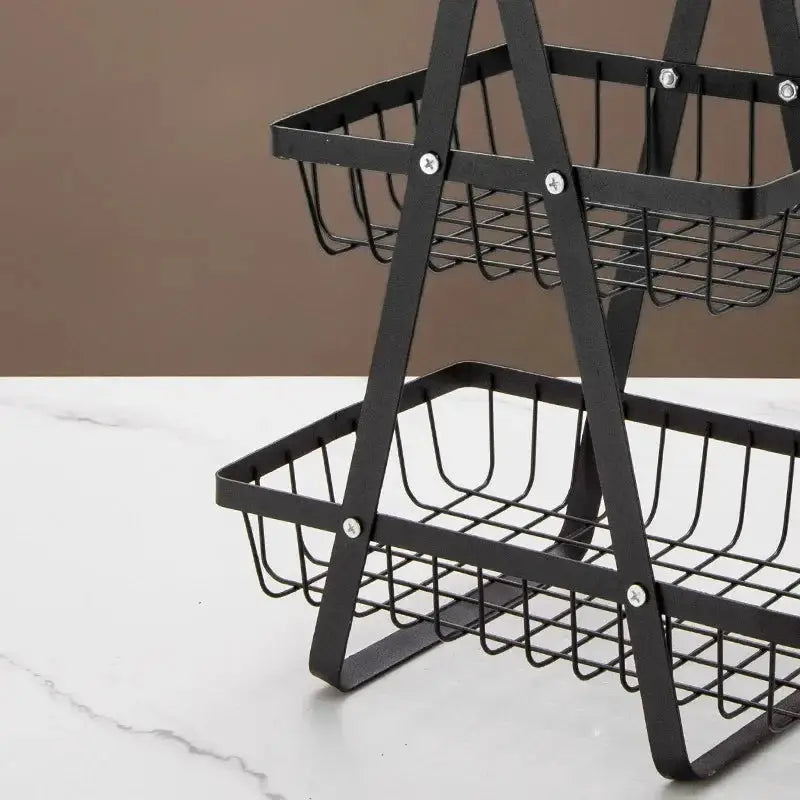 Close-up of the 2 Tier Steel Fruit Vegetable Basket showcasing its sturdy black metal frame and secure assembly. A durable and stylish kitchen storage solution.
