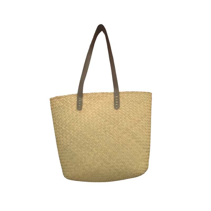 Roomy and lightweight Natural Seagrass Tote Bag with handmade craftsmanship and long brown straps, perfect for casual or beachwear.