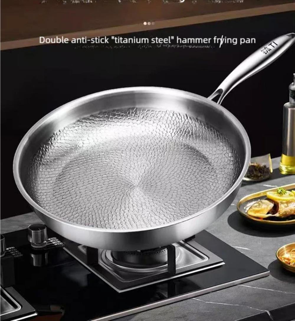 Titanium hammered frying pan with double anti-stick coating for durability and healthier cooking. Ideal for non-stick performance and easy cleaning.