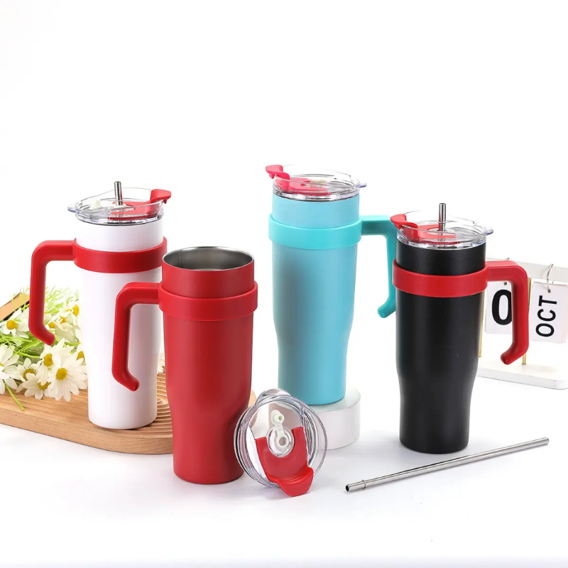 Set of colorful travel mugs with lids and straws on a white background
