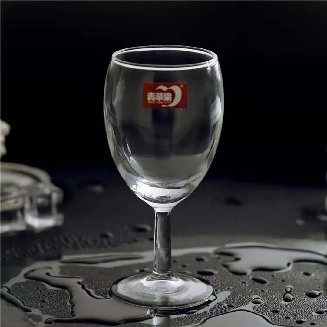 Empty short stem red wine glass on wet surface, 235 ml capacity, from 6PCS set. Explore affordable wine glasses in Sri Lanka.