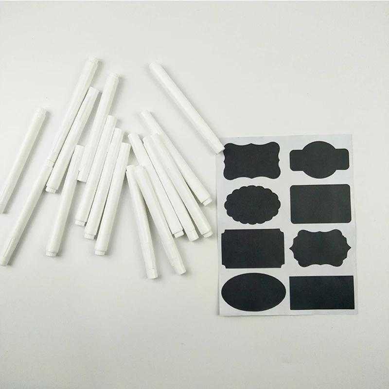 Multiple white chalk pens with assorted black label stickers, great for temporary signage and arts & crafts projects.
