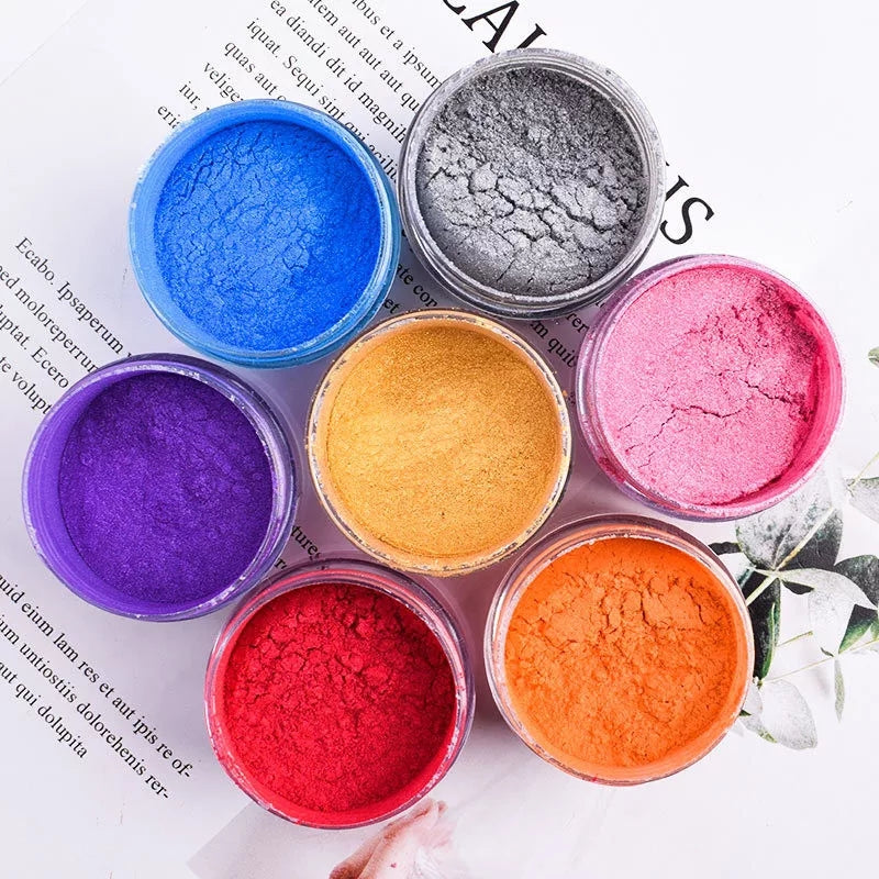 Top view of colorful edible dust powders in jars for cake decoration. Buy edible glitter powder online in Sri Lanka at Bamagate.com.