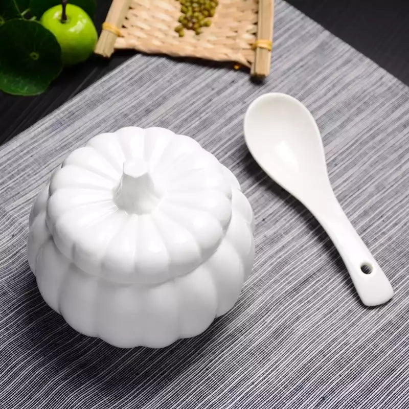 White Melamine Soup Spoon - Dishwasher Safe | 6x2 inches placed beside a ceramic pumpkin-shaped bowl, perfect for stylish kitchen and dining use.
