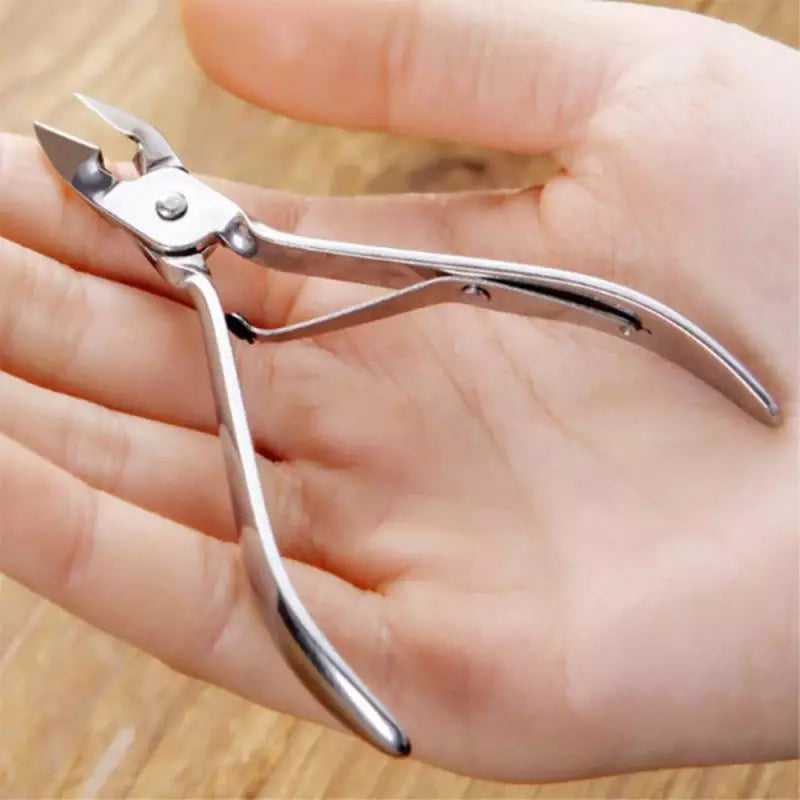 Toenail Clipper for Thick Toenails - Precise Trimming shown in hand, stainless steel design ideal for tough nail care. Shop nail clipper in Sri Lanka.