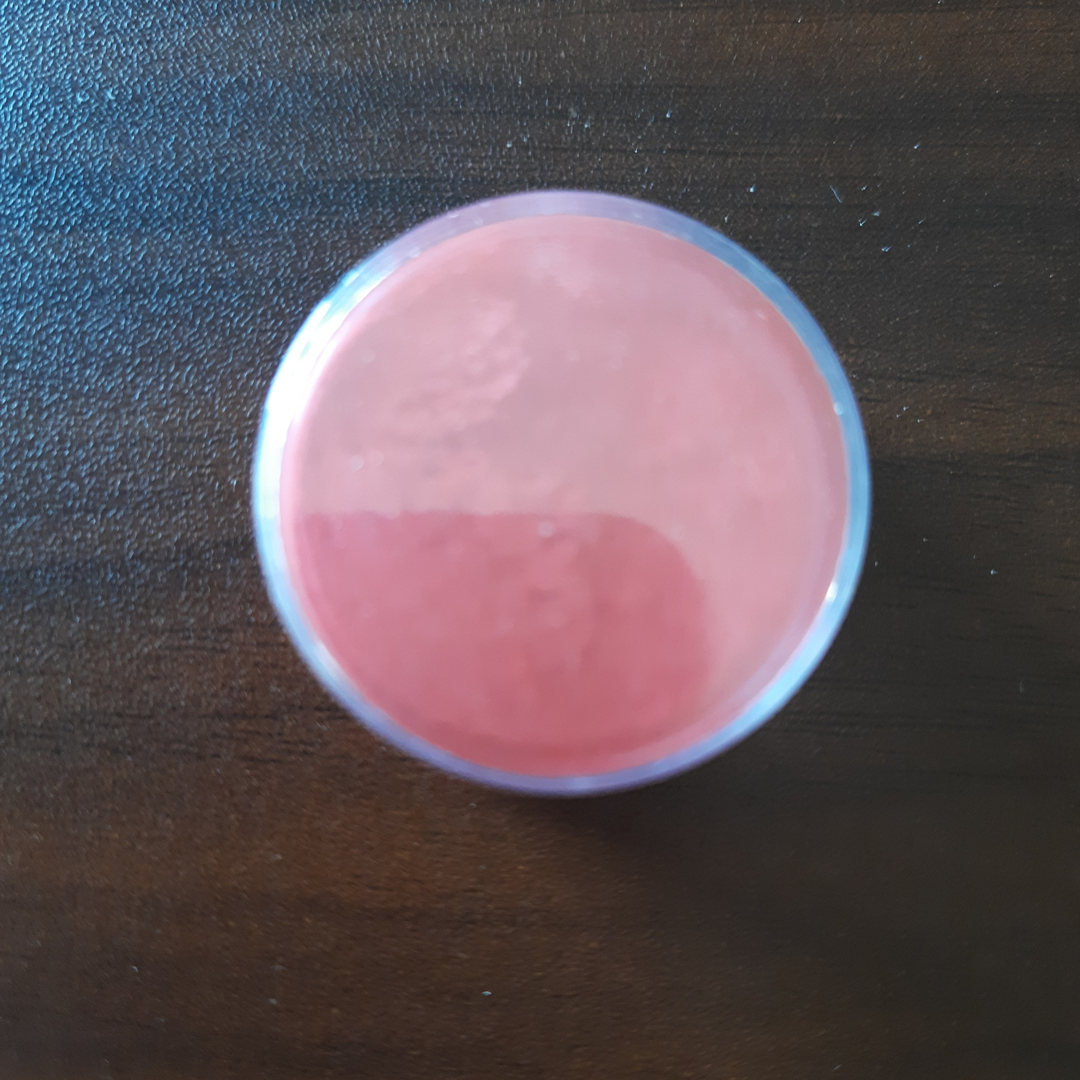 Red edible glitter powder in a clear container for cake decorating. Add vibrant color to desserts with Bamagate.com edible dust.