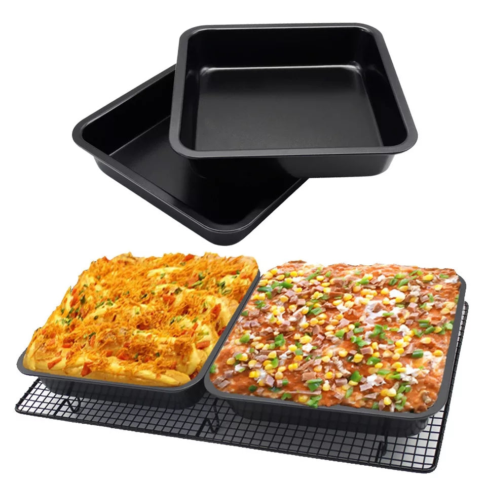 Nonstick 23cm square cake trays filled with baked dishes on a cooling rack, showcasing versatility for savory and sweet baking.