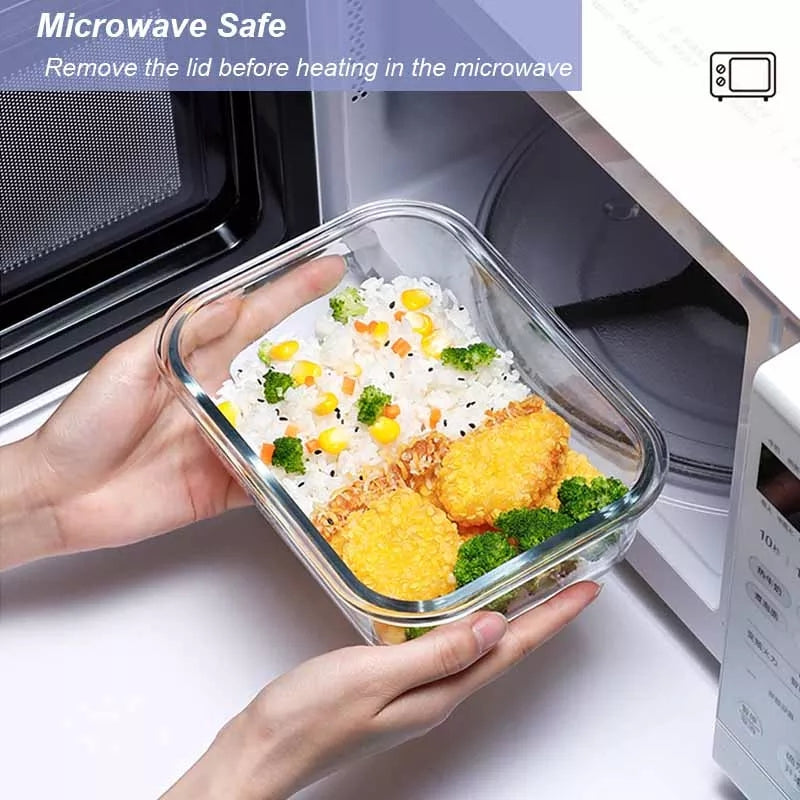 Glass food storage box with rice, vegetables, and fried cutlets, being placed in a microwave. Microwave-safe container for meal prep and storage.