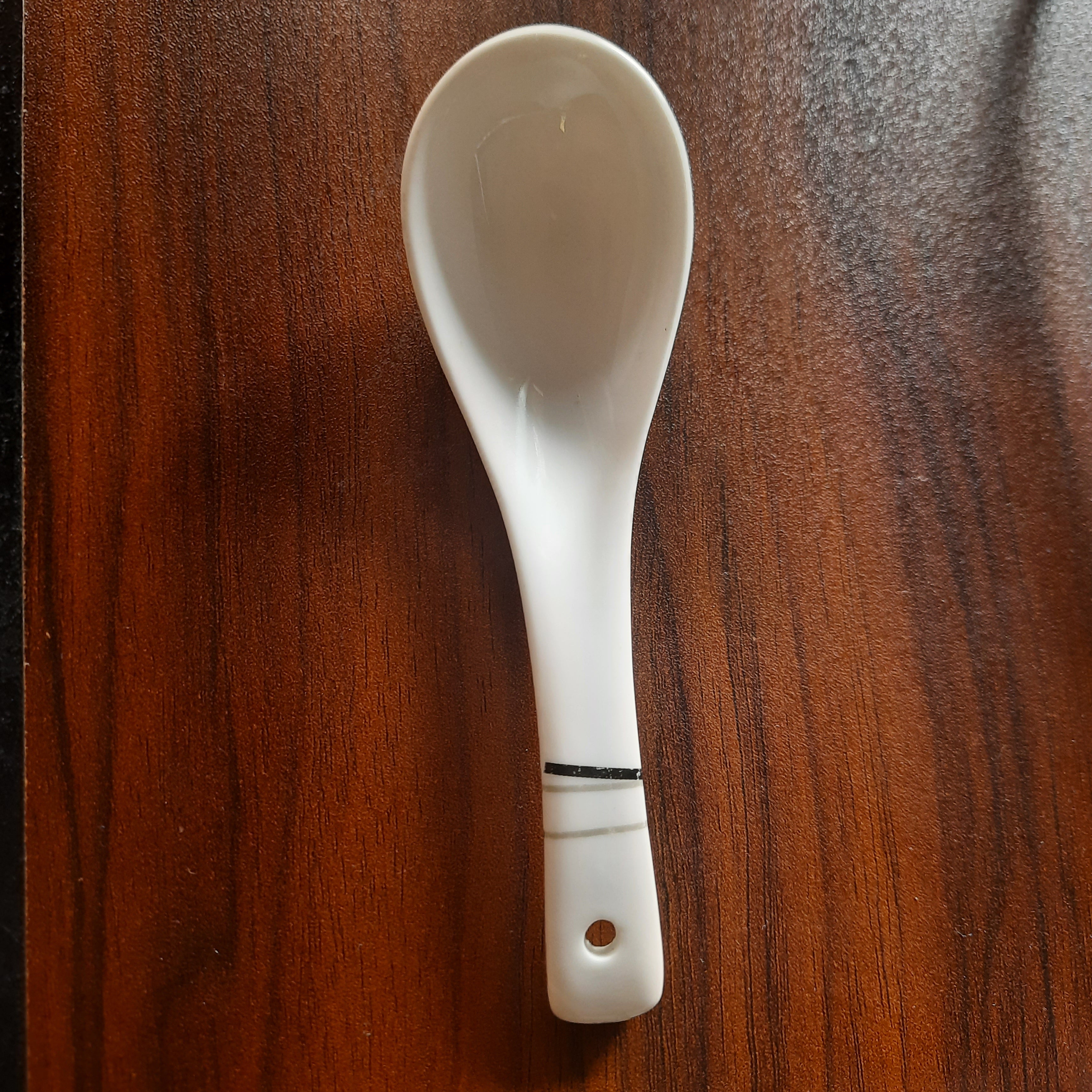 White Melamine Soup Spoon - Dishwasher Safe | 6x2 inches with a black stripe detail on handle, ideal for serving soups in home or restaurant settings.