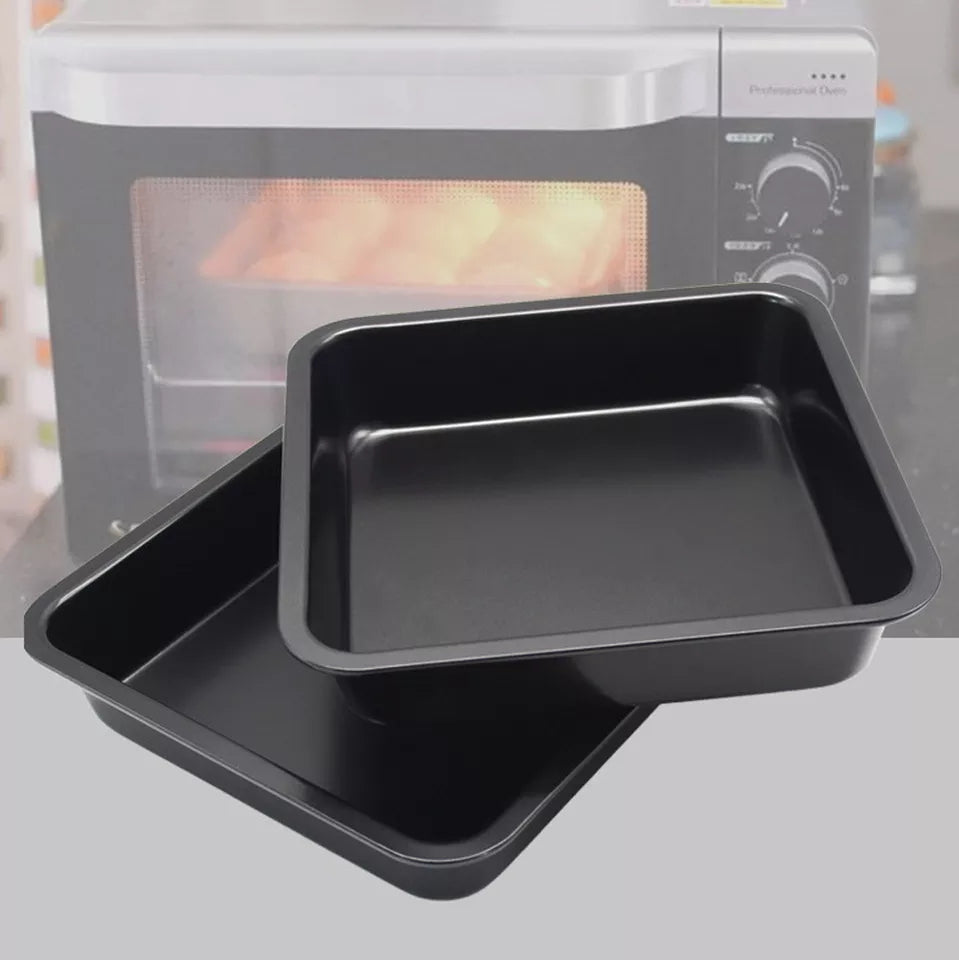 Durable 23cm nonstick square cake trays placed in front of an oven, perfect for home baking and heat distribution.