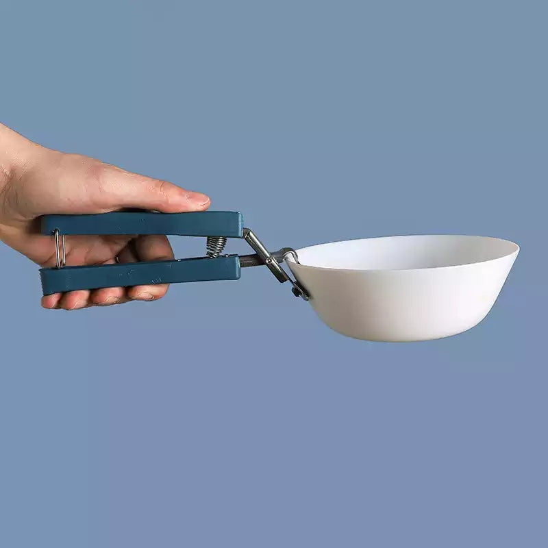 Anti-hot Plate Gripper Lifter Tongs securely holding a white bowl, perfect for handling hot cookware in the kitchen. Buy heat-resistant tongs in Sri Lanka.