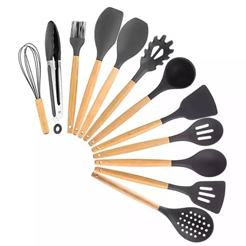 Full 12-piece grey silicone utensil set with wooden handles, including spatulas, spoons, whisk, and tongs for kitchen use.