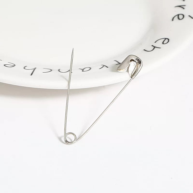 Single open Safety Pin Nickel Plated from 12 PCS set, showcasing sharp tip and sturdy clasp for reliable fastening in DIY and household tasks.