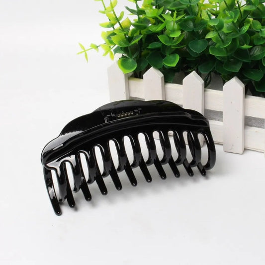 Hair Claw Clip Black for Women - Bamagate.com, glossy black plastic claw clip with strong grip, ideal for thick or curly hair types.