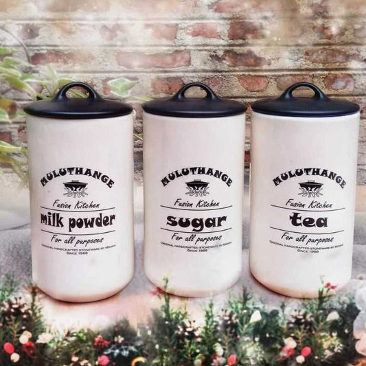 Set of 3 Muluthange large ceramic storage jars labeled milk powder, sugar, and tea with airtight lids. Ideal kitchen storage solution in Sri Lanka.