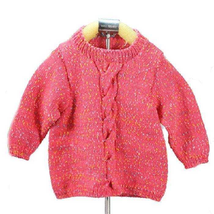 Children’s sweater knitted with pink cotton crochet yarn, showcasing colorful speckles and a central cable design. Made from self-striping 50g yarn.